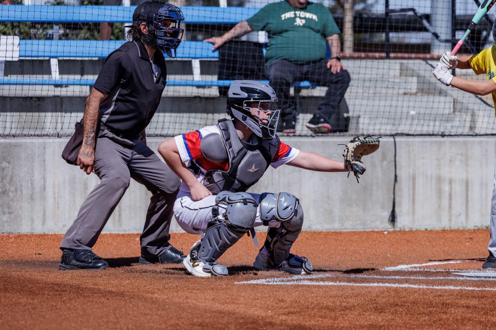 Road Runners catcher receiving a pitch during game action